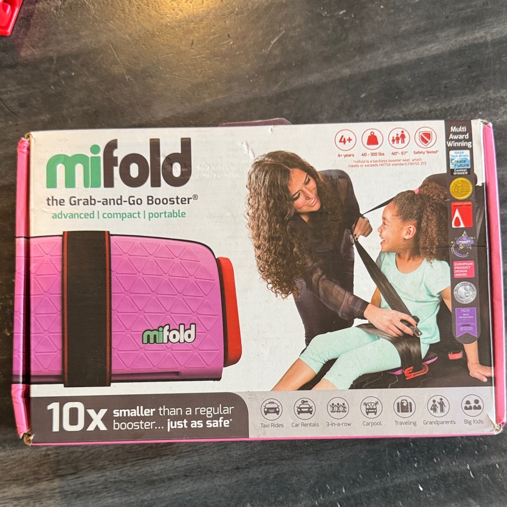 Mifold Grab-and-Go Booster Seat in Pink and Black